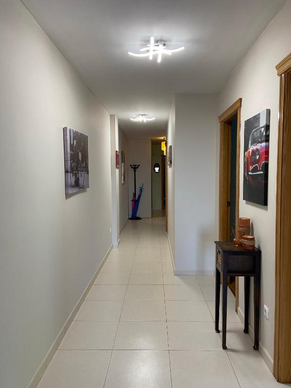Televízia a/alebo spoločenská miestnosť v ubytovaní Altavista Apartment