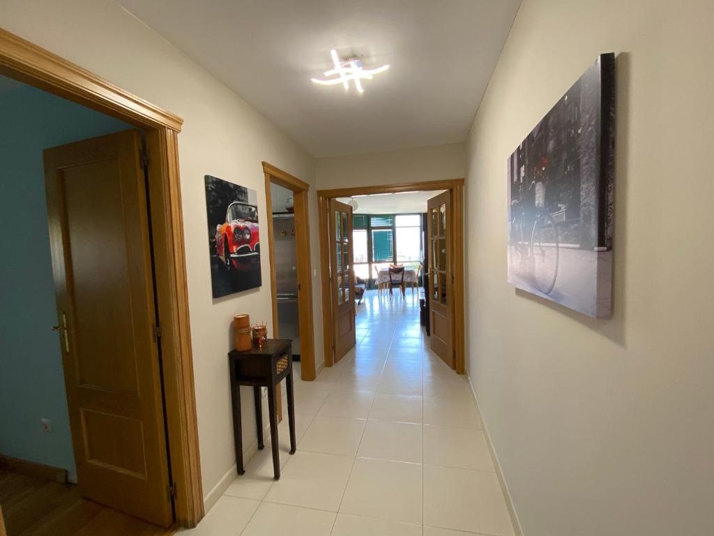 Televízia a/alebo spoločenská miestnosť v ubytovaní Altavista Apartment