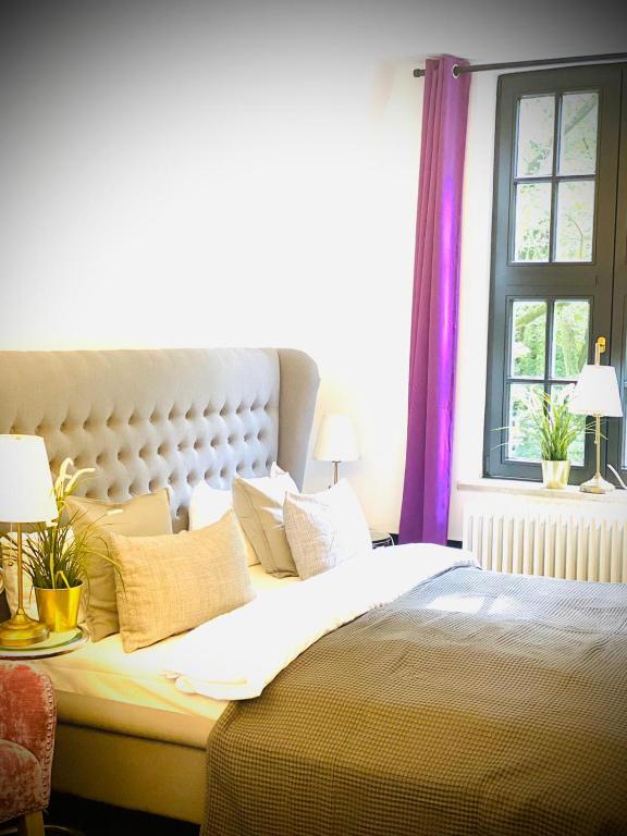 Postel nebo postele na pokoji v ubytování Sleephotels Suite Garde