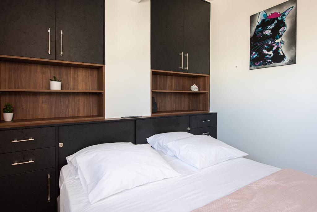 A bed or beds in a room at Analogy chania apartment