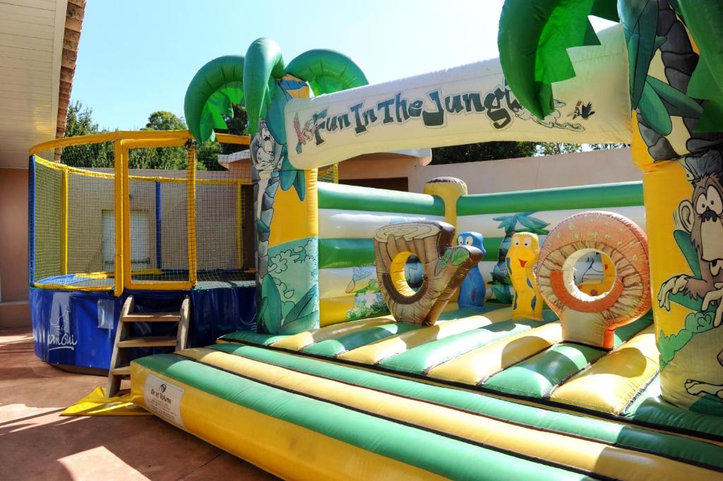 a water park with an inflatable playground at Résidence Les Castors in Calvi