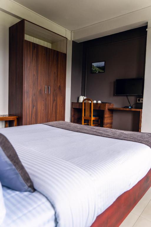 Postel nebo postele na pokoji v ubytování Hotel Ariel