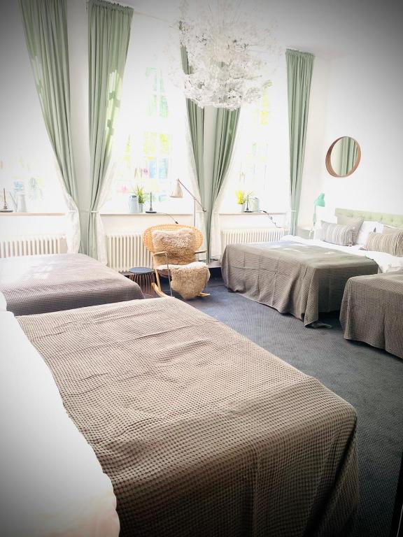 Postel nebo postele na pokoji v ubytování Sleephotels Suite Garde