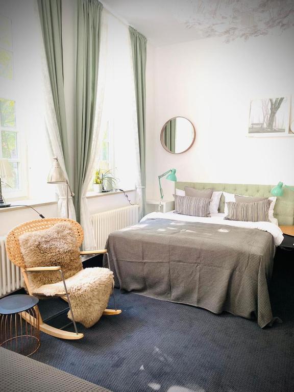 Postel nebo postele na pokoji v ubytování Sleephotels Suite Garde