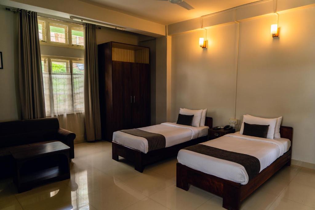 Postel nebo postele na pokoji v ubytování Hotel Ariel