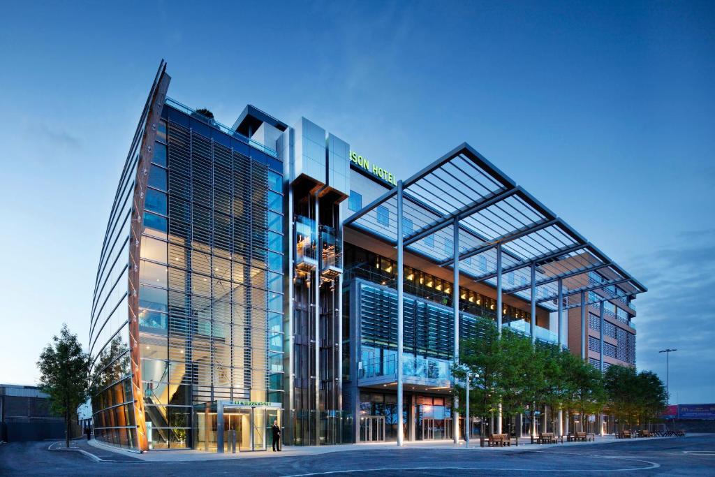 a large glass building with a lot of windows at The Gibson Hotel in Dublin