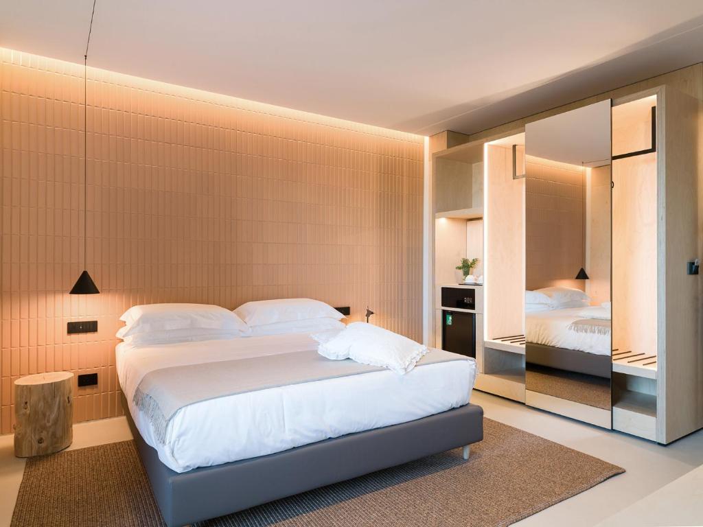 Postel nebo postele na pokoji v ubytování Criu Boutique Hotel