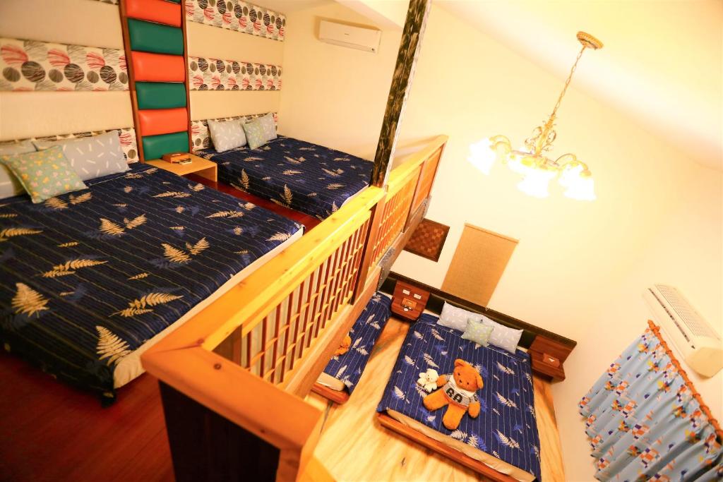 Postel nebo postele na pokoji v ubytování 鄉間雅築休閒民宿Country Villa Homestay