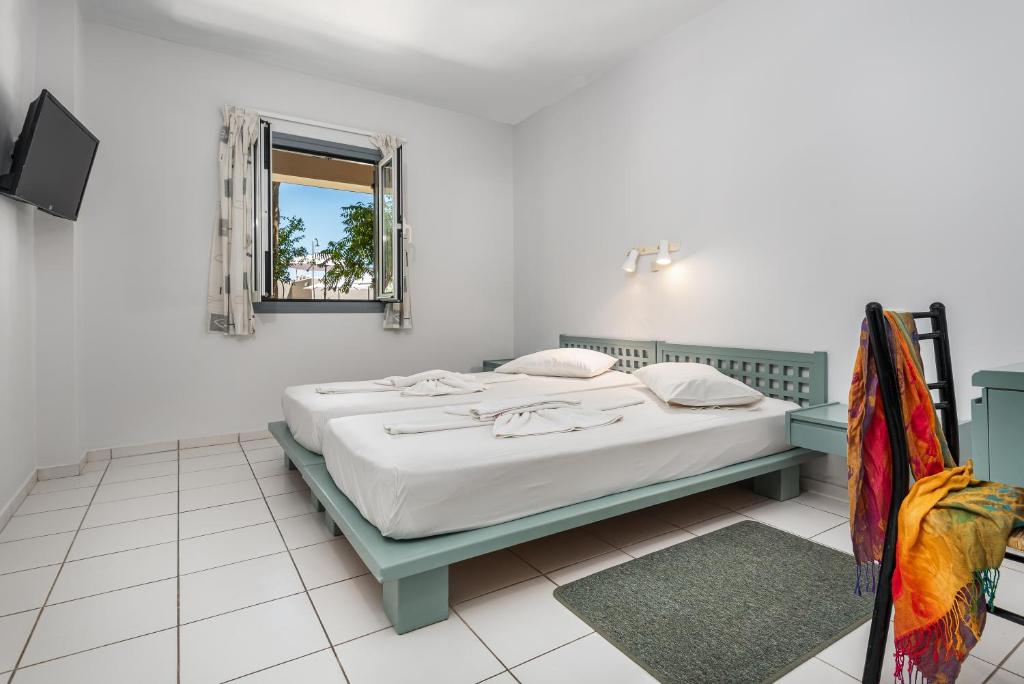 A bed or beds in a room at Aphea Village