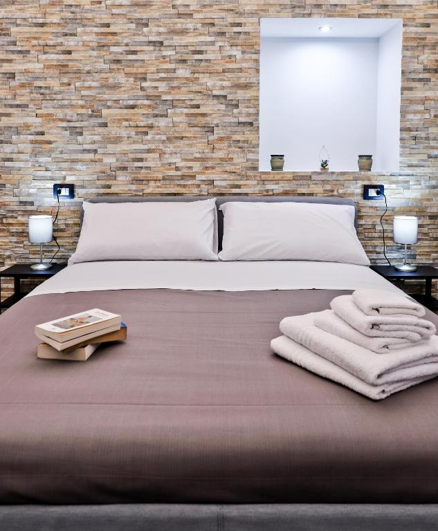 Posteľ alebo postele v izbe v ubytovaní Terra Mia Savoia B&B