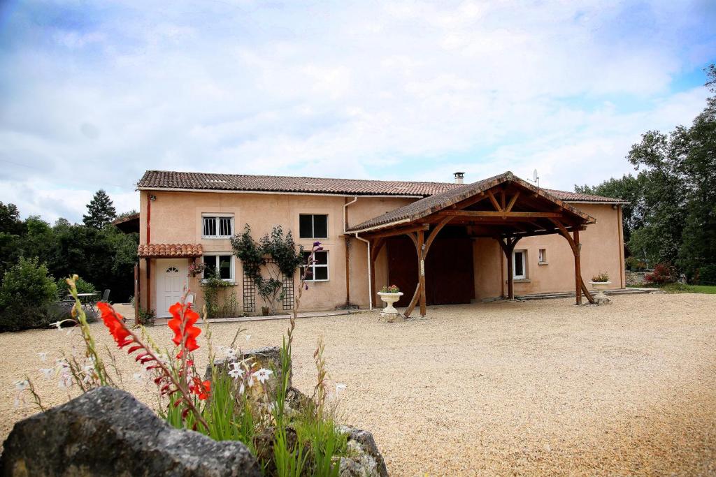 a house with a pavilion in front of it at Launie Lea in Eyzerac