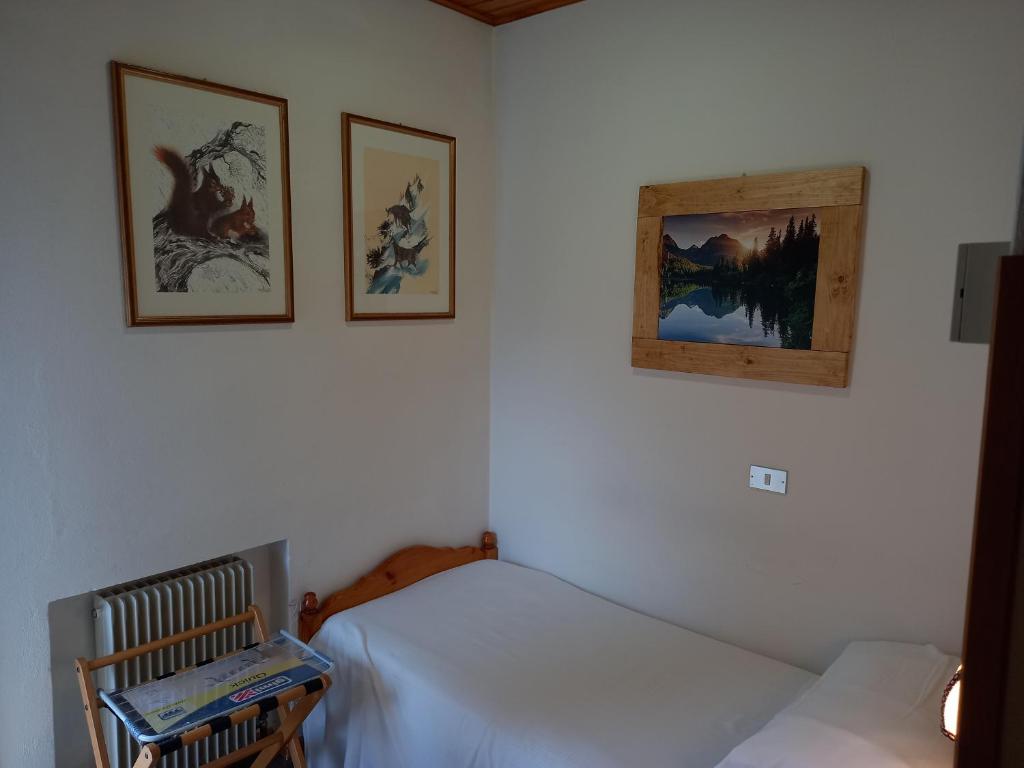 Postel nebo postele na pokoji v ubytování Albergo Scoiattolo