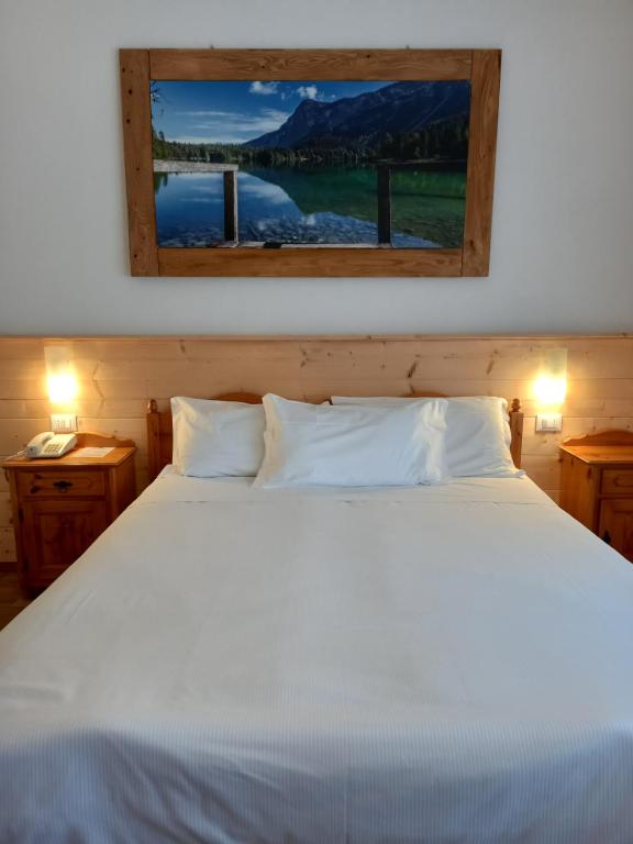 Postel nebo postele na pokoji v ubytování Albergo Scoiattolo
