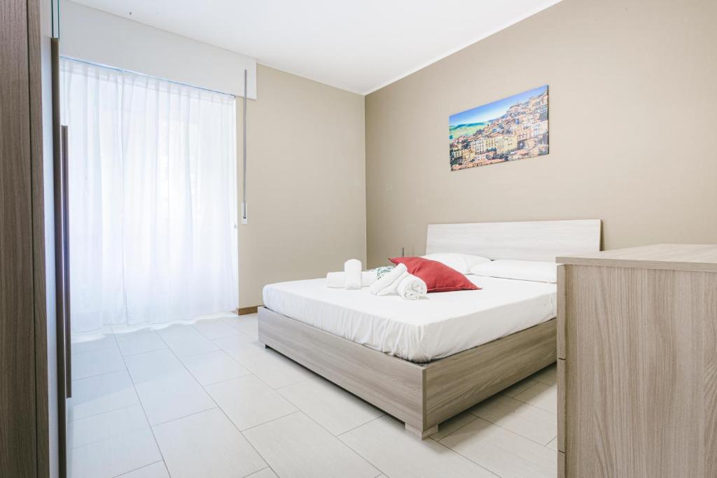 Postel nebo postele na pokoji v ubytování Grab a Flat in Coroneo