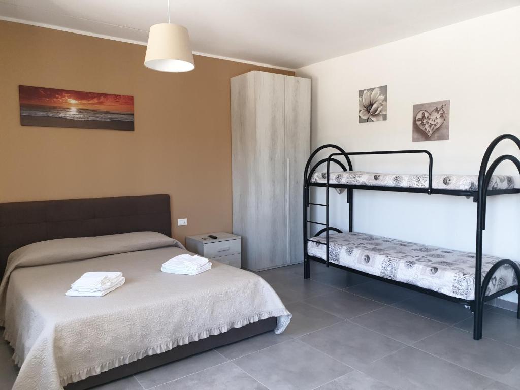 Postel nebo postele na pokoji v ubytování Campagna D'aMare