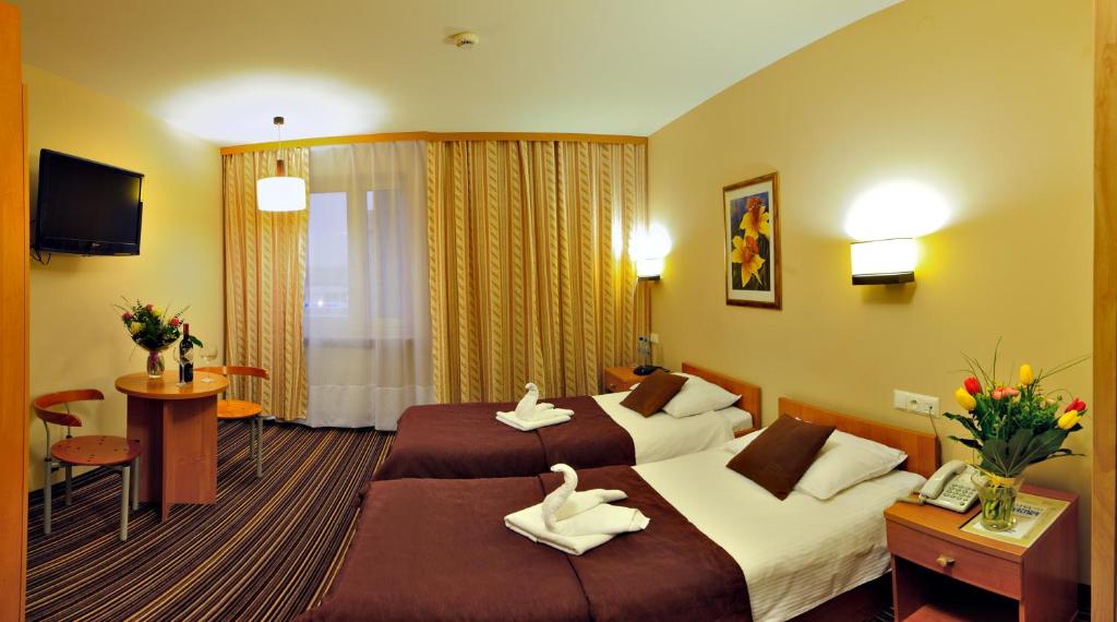 Posteľ alebo postele v izbe v ubytovaní Hotel Partner