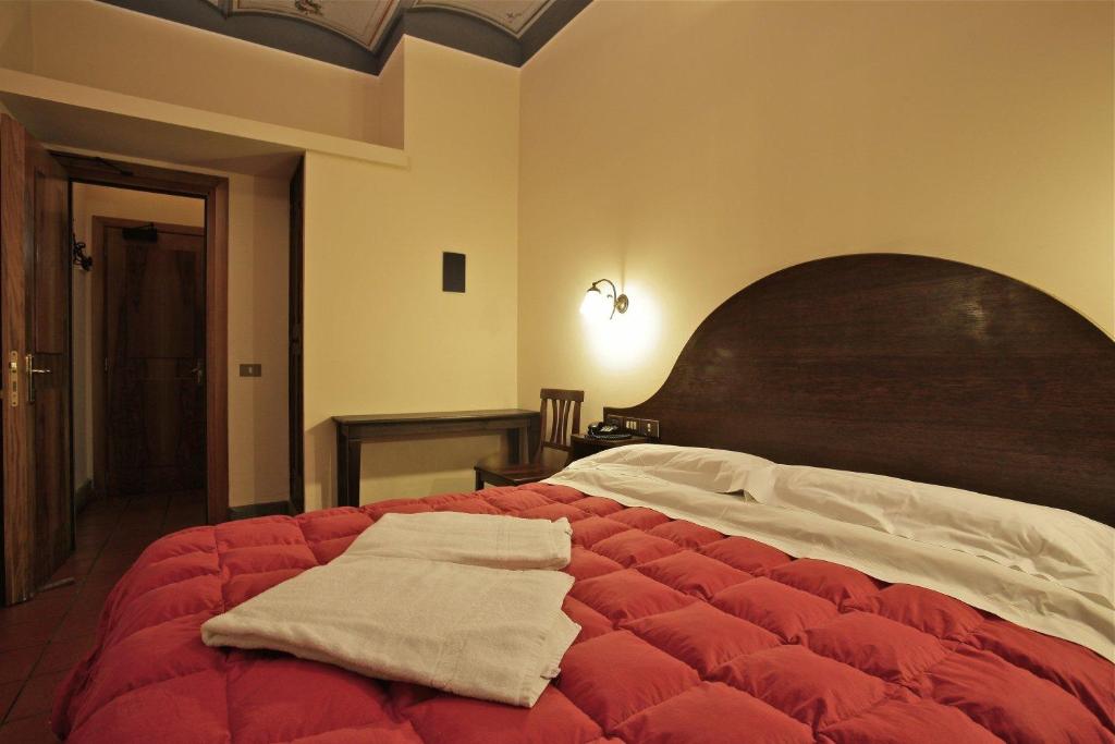 Postel nebo postele na pokoji v ubytování Hotel Panda