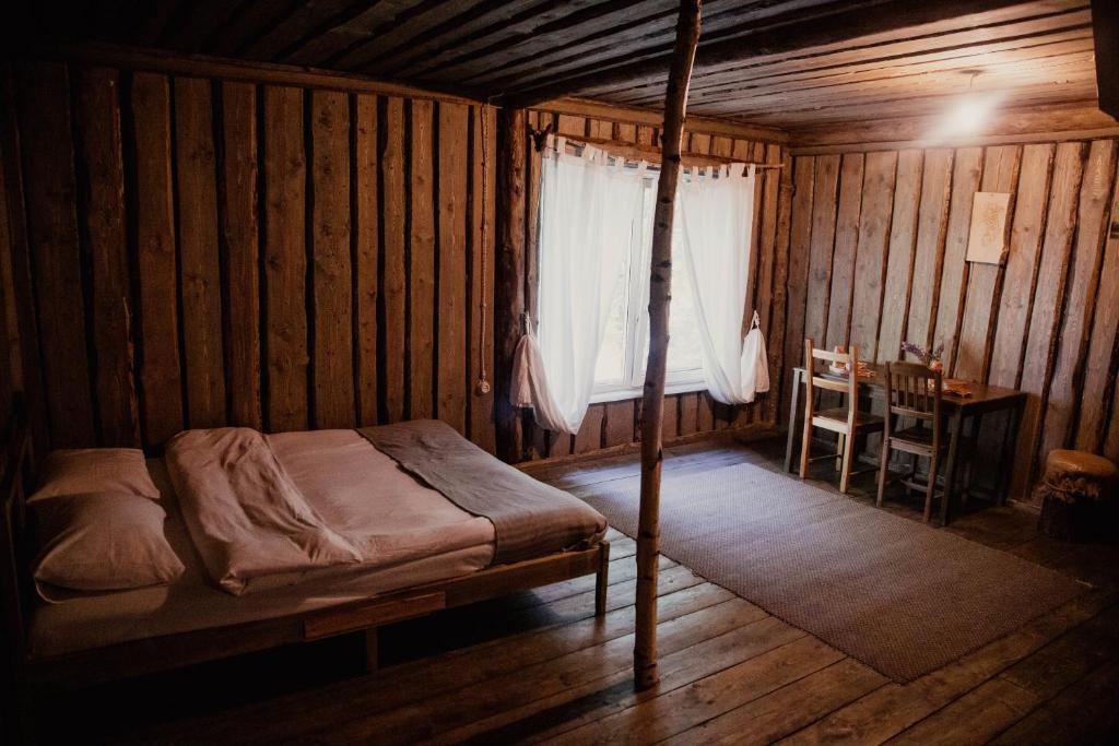 Postel nebo postele na pokoji v ubytování Ethno-Usadba
