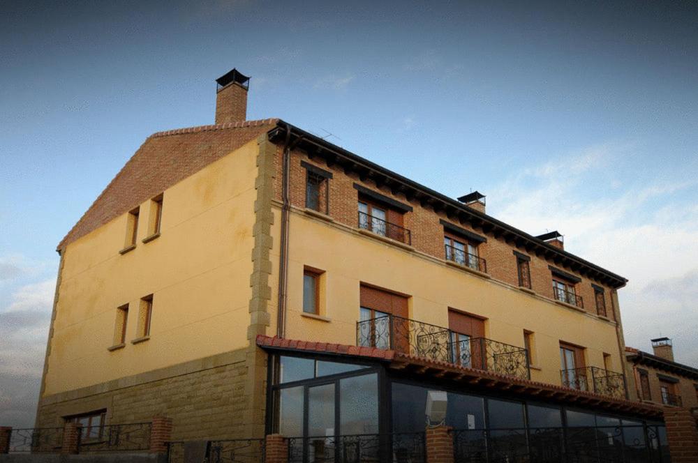 a large building with a balcony on top of it at Hotel La Barrosa in Abejar