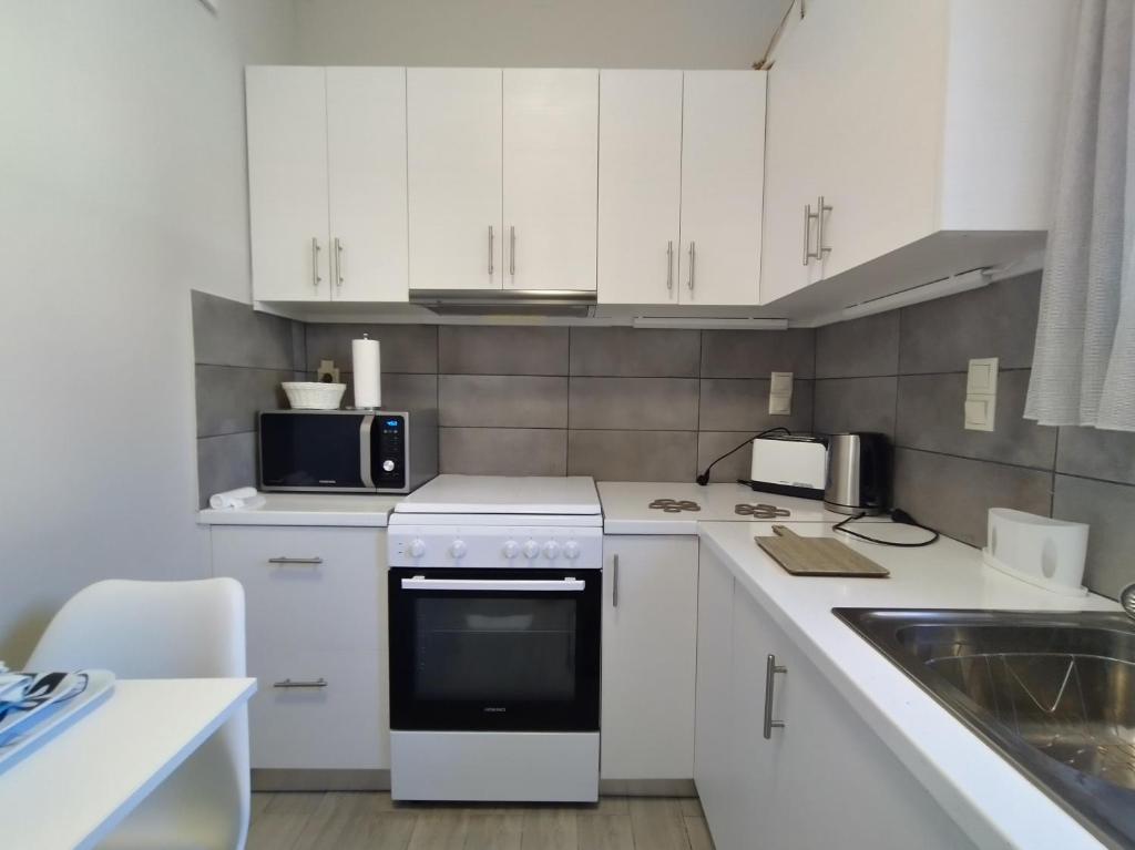 Kuchyňa alebo kuchynka v ubytovaní Daglas Beach House