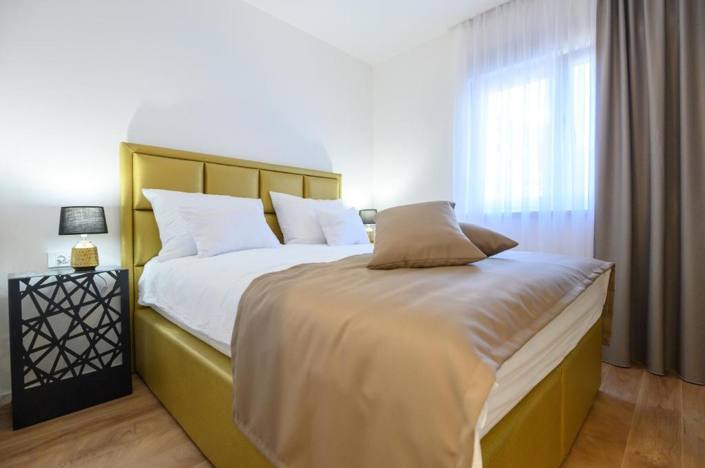 Posteľ alebo postele v izbe v ubytovaní Luxury Apartments Leonika