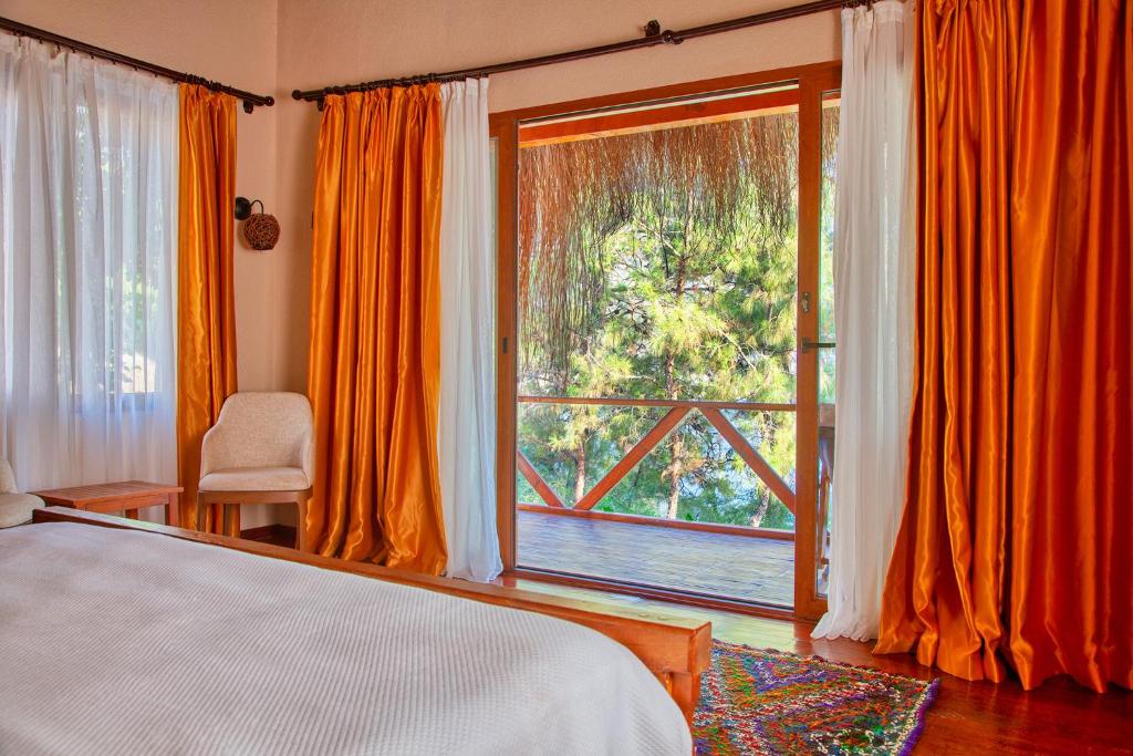 Кровать или кровати в номере La Boheme Kabak Adults Only