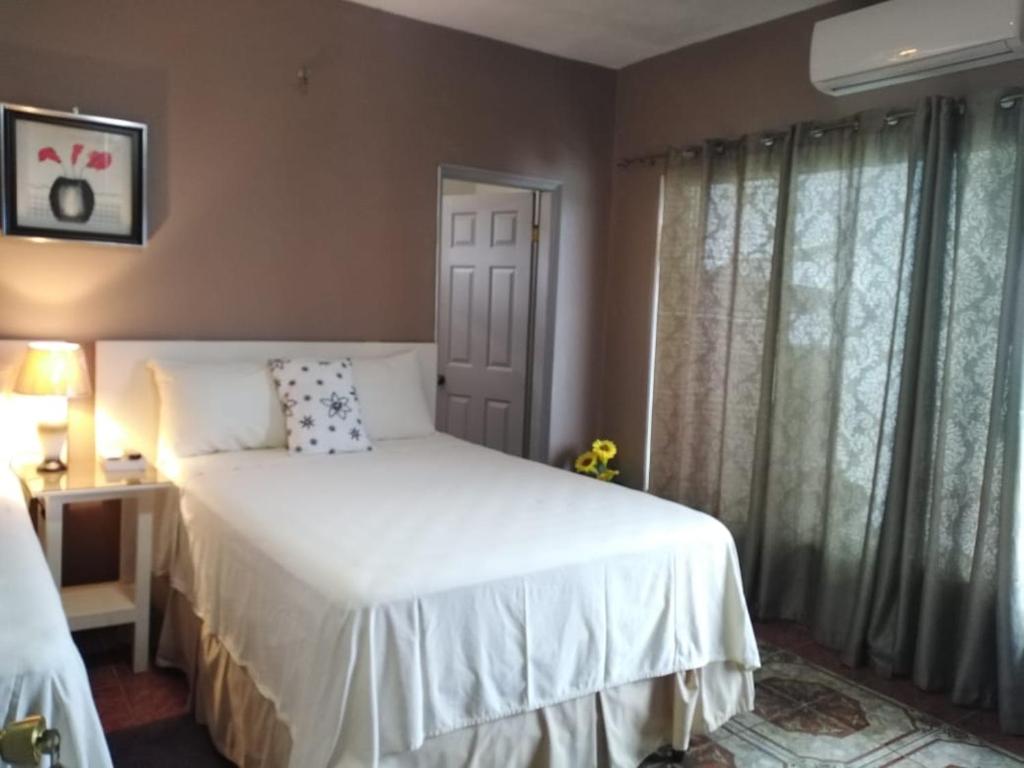 Postel nebo postele na pokoji v ubytování Hotel Vista del Mar