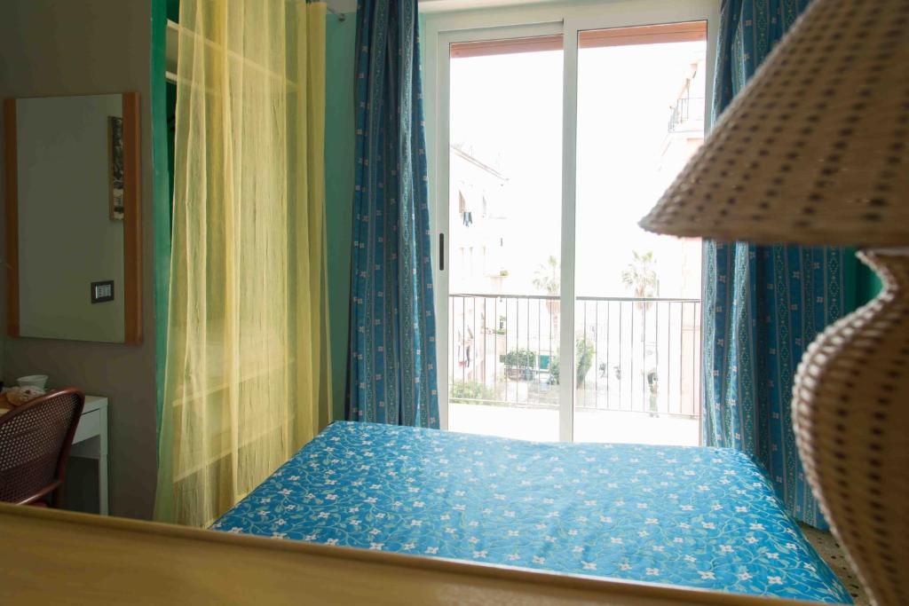 Łóżko lub łóżka w pokoju w obiekcie Hotel Elisabetta
