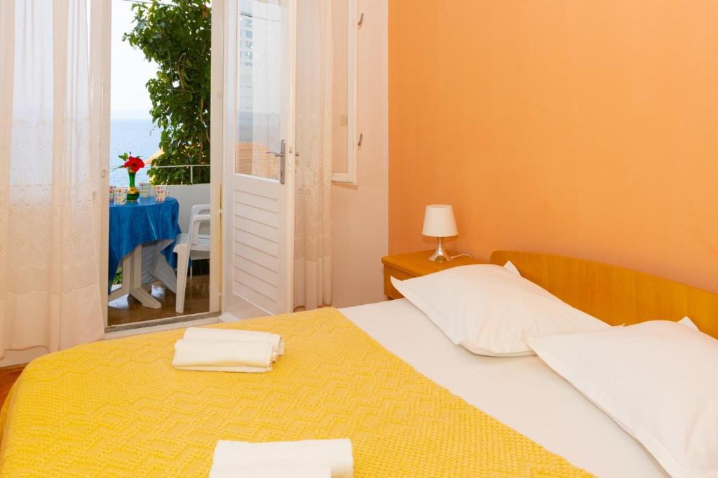 Posteľ alebo postele v izbe v ubytovaní Apartmani Vranjes 2