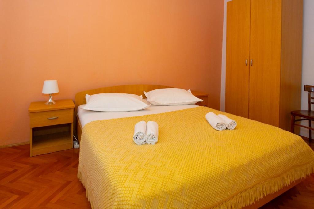 Posteľ alebo postele v izbe v ubytovaní Apartmani Vranjes 2