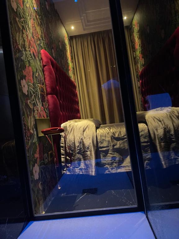 Postel nebo postele na pokoji v ubytování Ninfa hotel