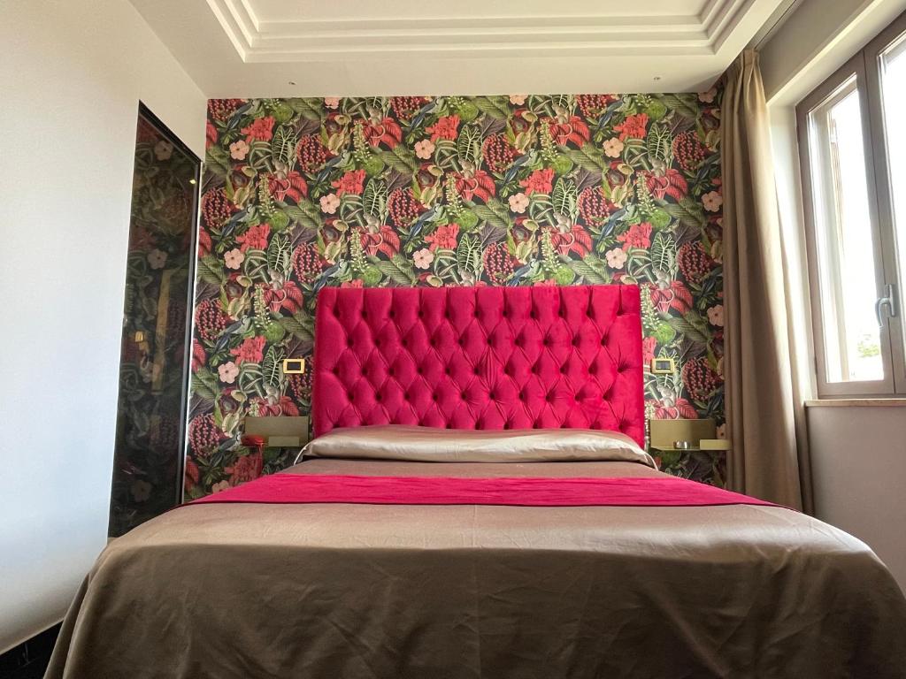 Postel nebo postele na pokoji v ubytování Ninfa hotel