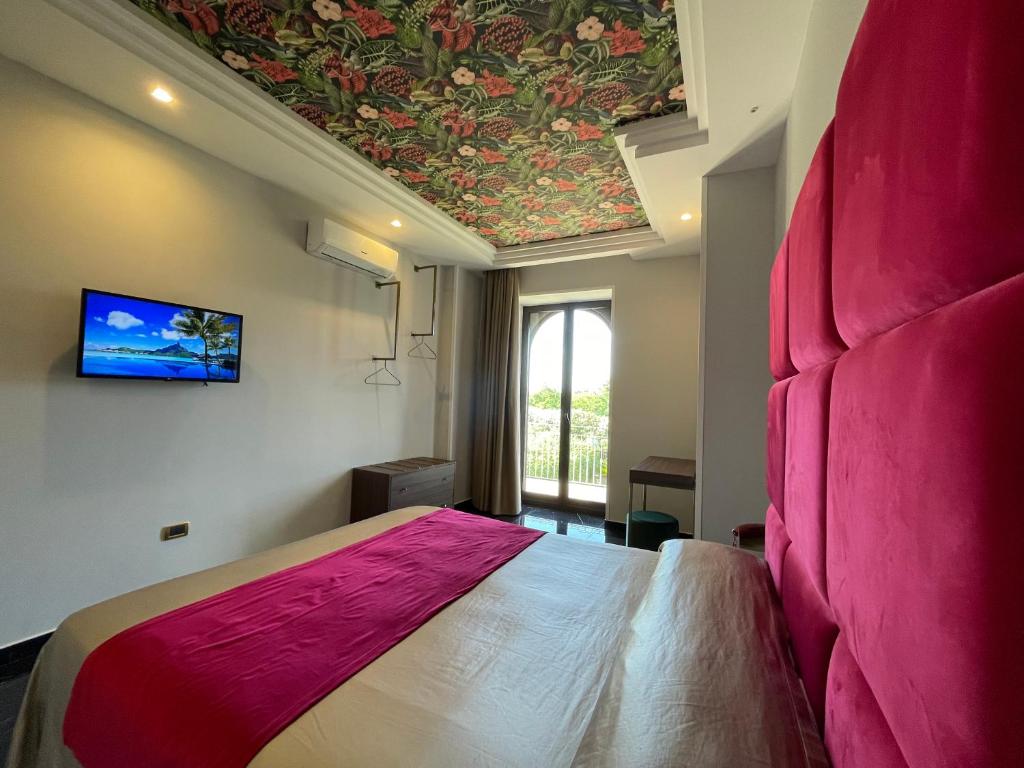 Postel nebo postele na pokoji v ubytování Ninfa hotel
