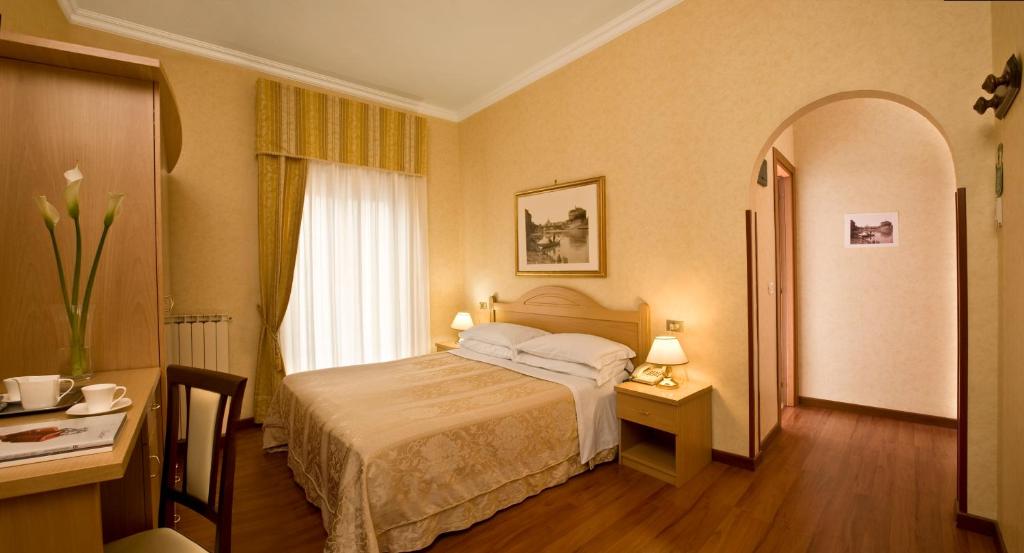 Postel nebo postele na pokoji v ubytování Hotel Siviglia