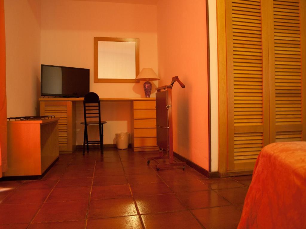 TV a/nebo společenská místnost v ubytování Hotel Garibaldi