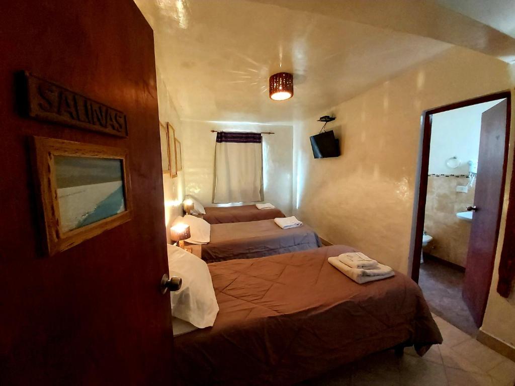 Una cama o camas en una habitación de Hosteria Maimará