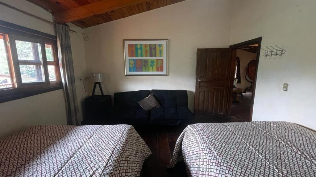 Postel nebo postele na pokoji v ubytování Cabañas Yasmina