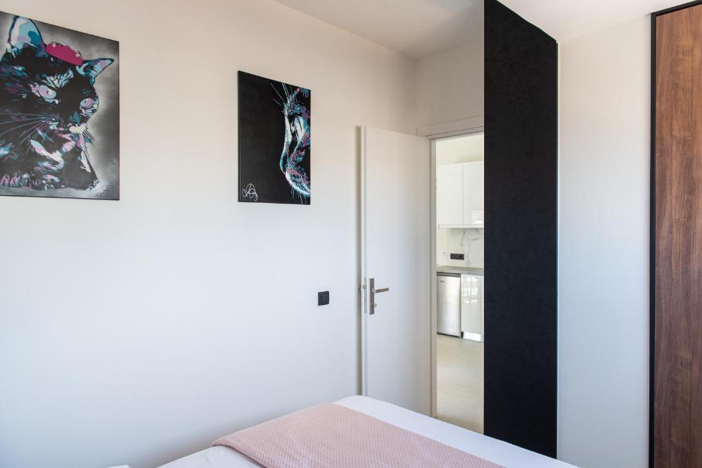 A bed or beds in a room at Analogy chania apartment