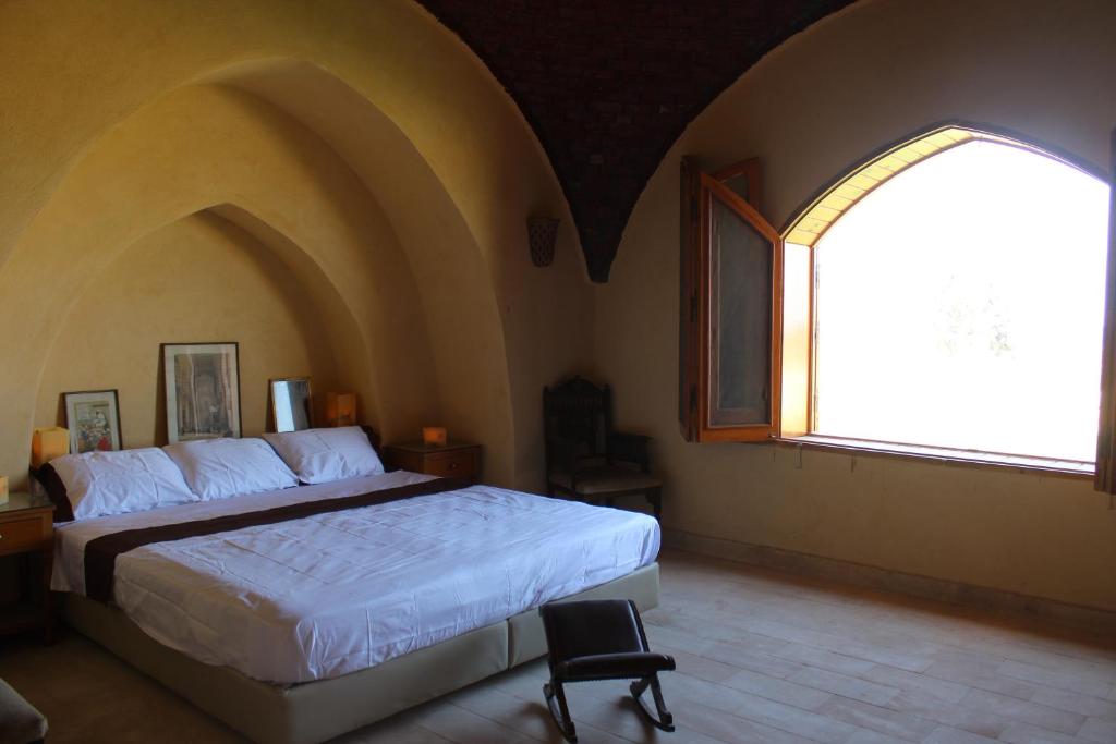 Postel nebo postele na pokoji v ubytování Kom El Dikka Agri Lodge