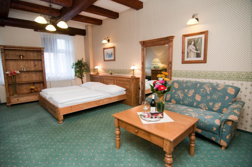Postel nebo postele na pokoji v ubytování Hotel & Caffe Silesia