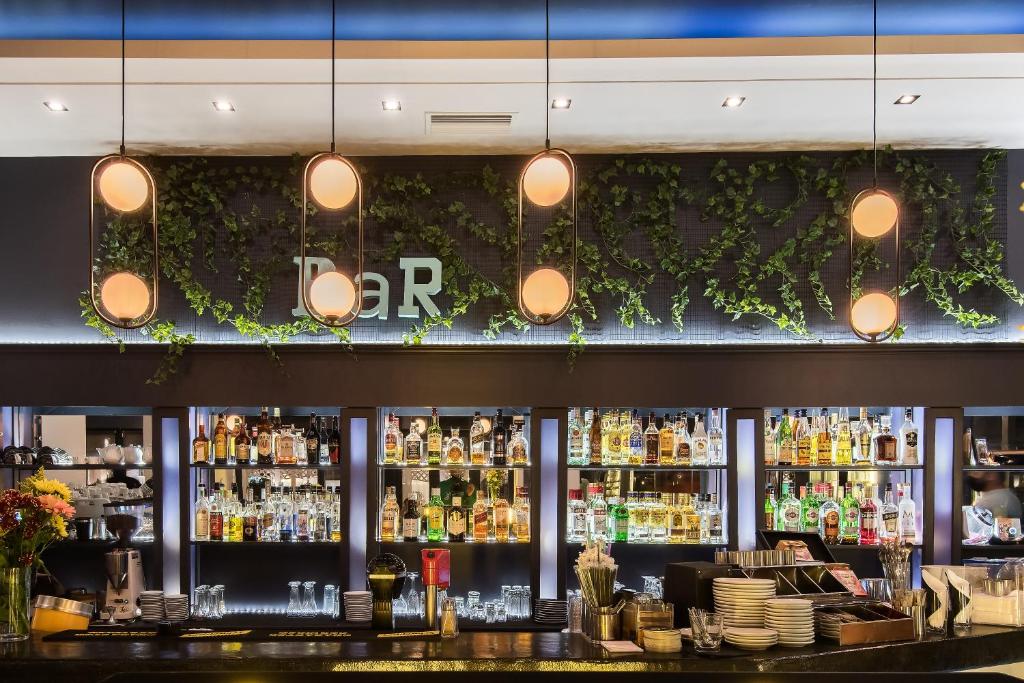 a bar with a lot of bottles of alcohol at Klimis Hotel in Spetses
