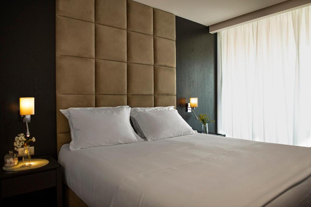 Postel nebo postele na pokoji v ubytování Amare Hotel