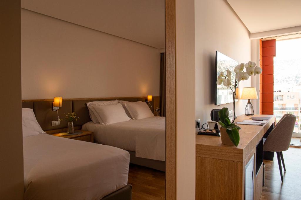 Voodi või voodid majutusasutuse Amare Hotel toas