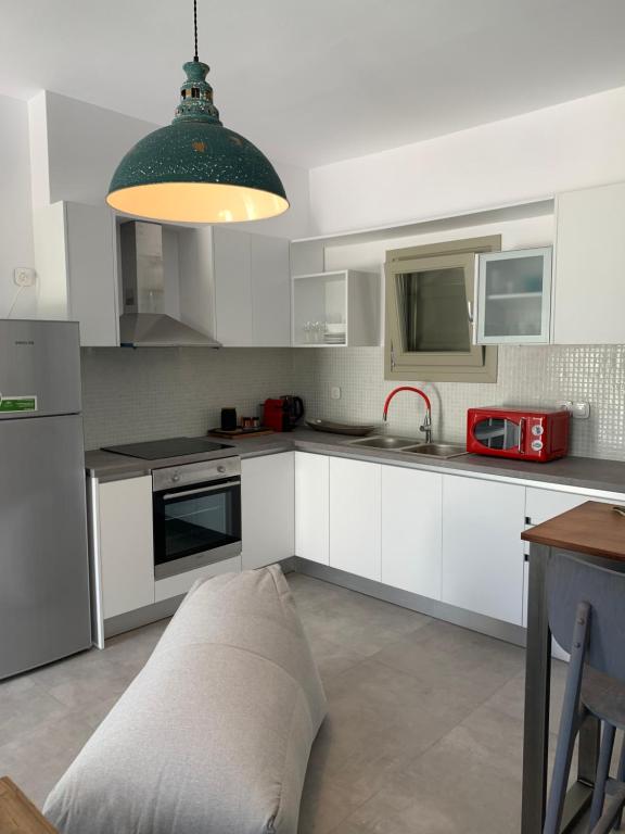 Kuchyň nebo kuchyňský kout v ubytování Chrisantakis appartments