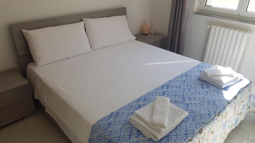 Postel nebo postele na pokoji v ubytování B&B Da Pietro