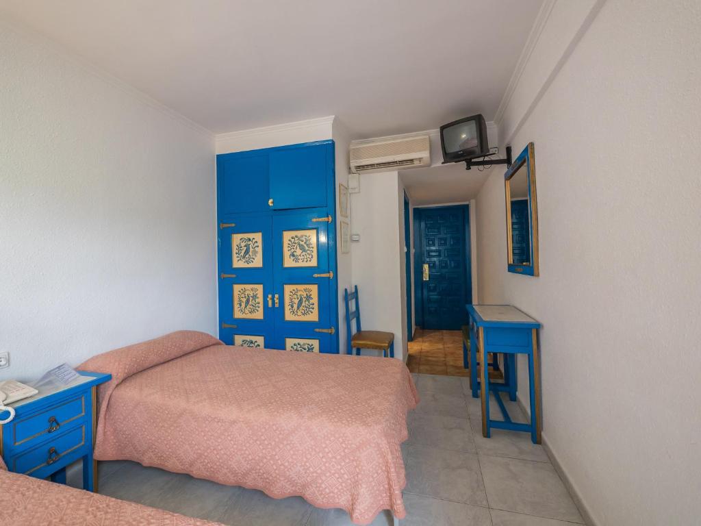 Postel nebo postele na pokoji v ubytování Checkin Garbí