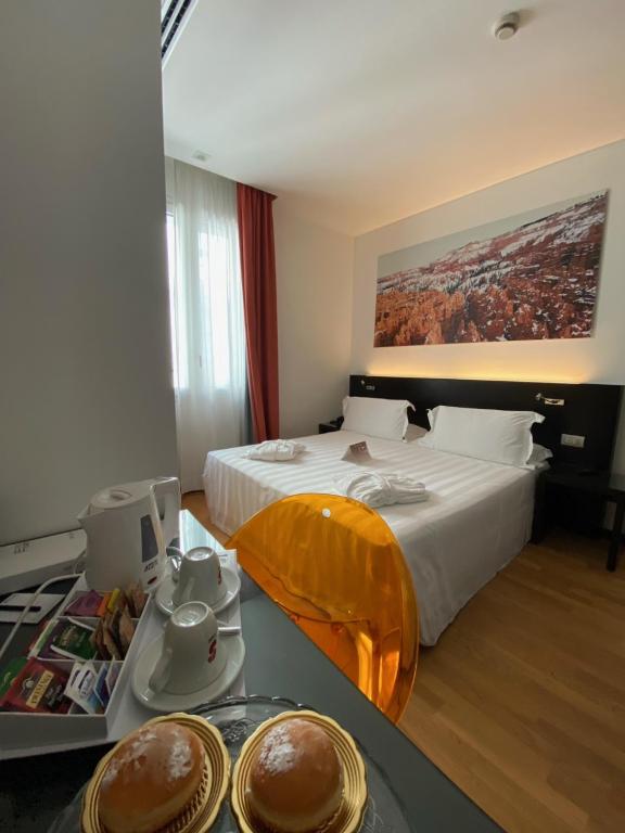 Postel nebo postele na pokoji v ubytování Card International Hotel