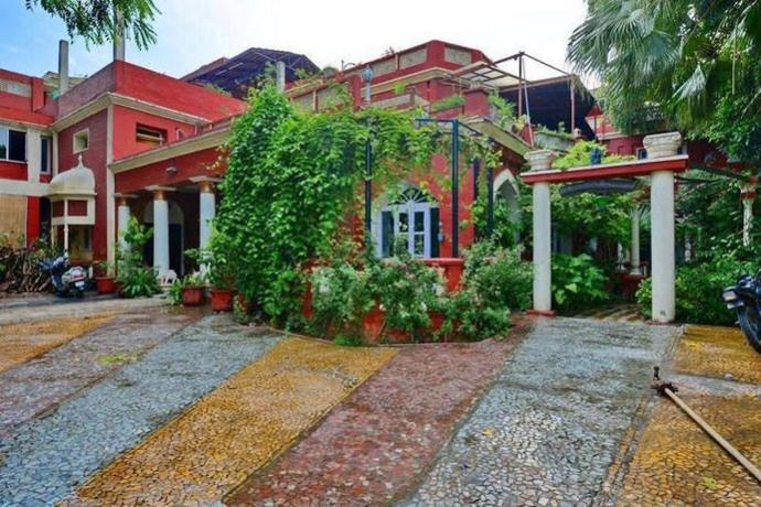 a large house with a yard in front of it at Ranjit's Svaasa Amritsar in Amritsar