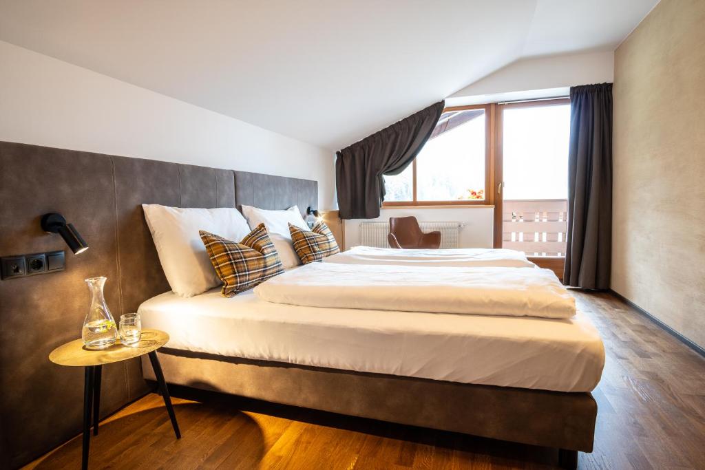 Postel nebo postele na pokoji v ubytování Hotel Mont Floris Obereggen