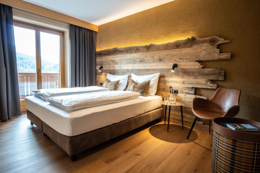 Postel nebo postele na pokoji v ubytování Hotel Mont Floris Obereggen